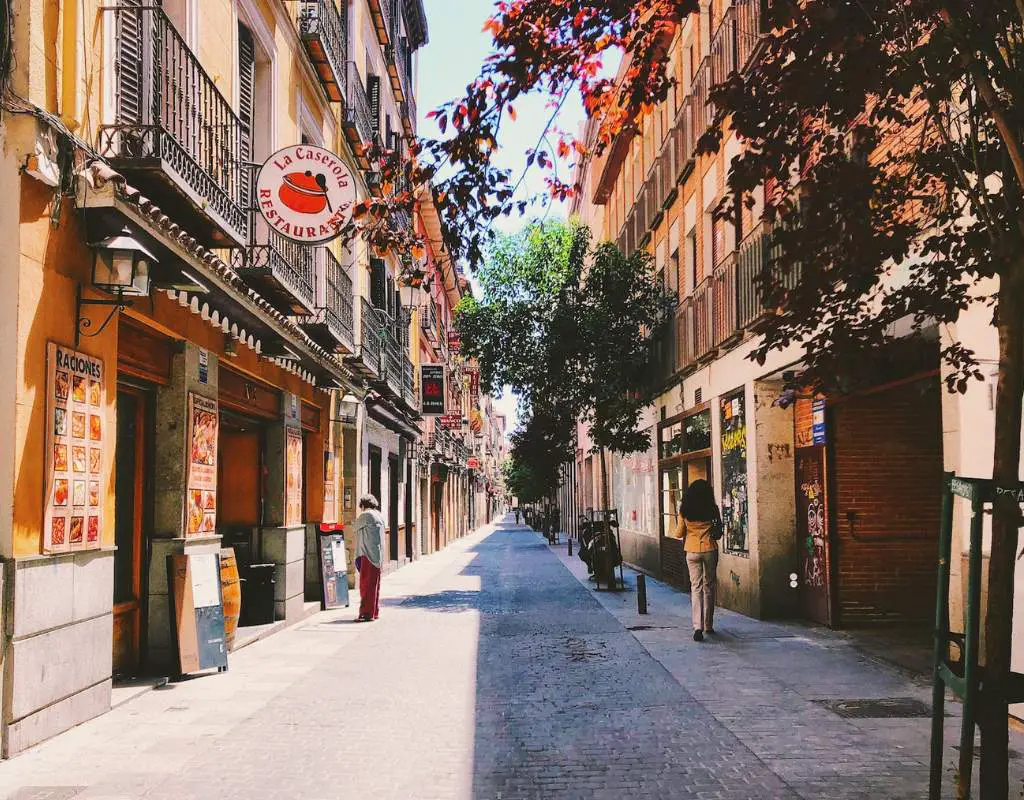 Madrid road alley between restaurants